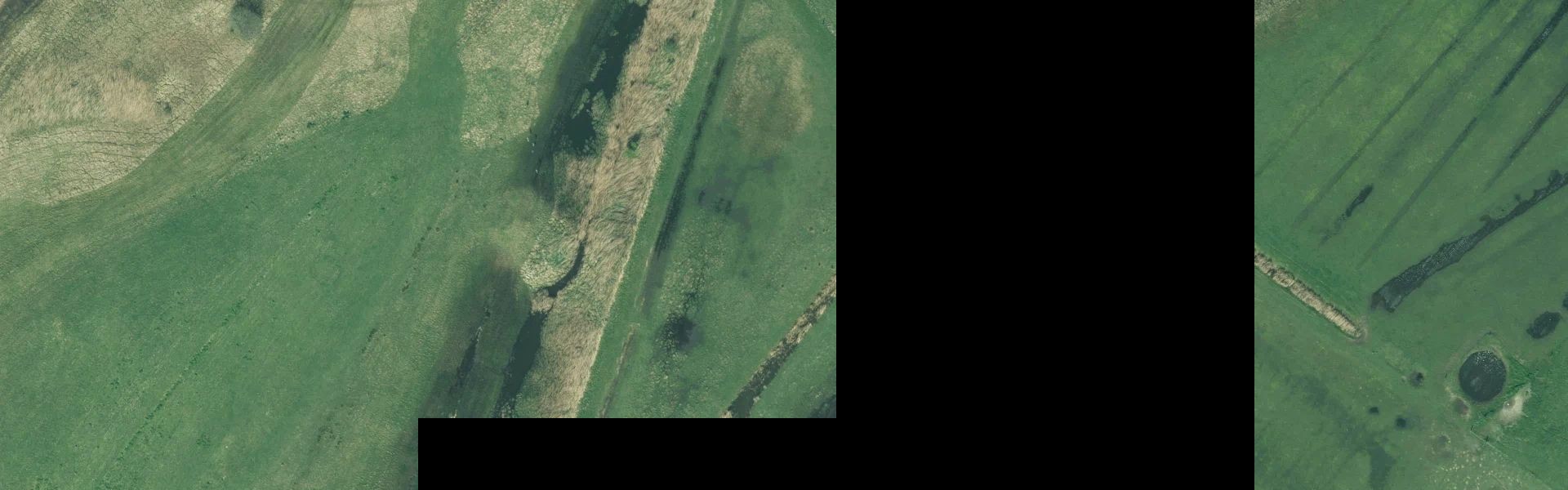 Satellietfoto van De Cocksdorp met zichtbare zonnepanelen